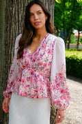 Blus med blommönster i rosa